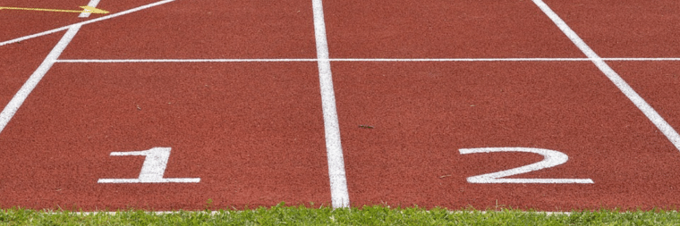 A close up to an athlete track, numbers 1 and 2 are visible